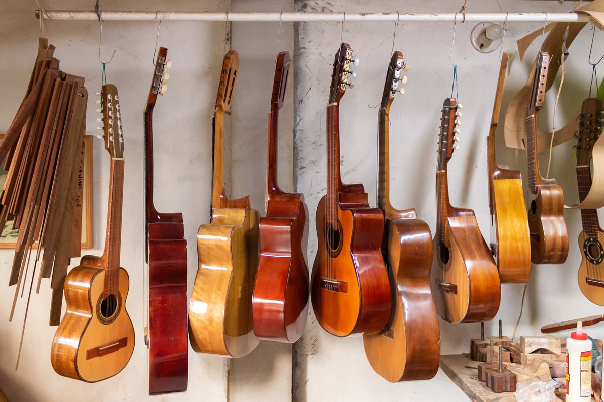 Acoustic guitars hanging in a luthier's workshop